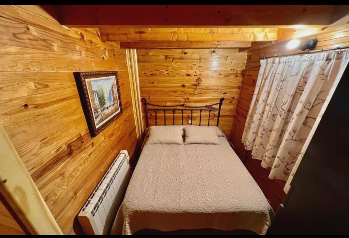 Dormitorio acogedor en la cabaña